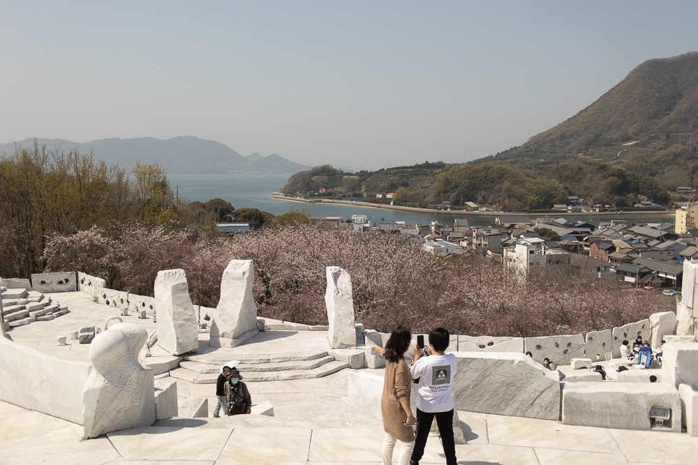 A large marble platform full of tourists overlooking the islands around Setoda.